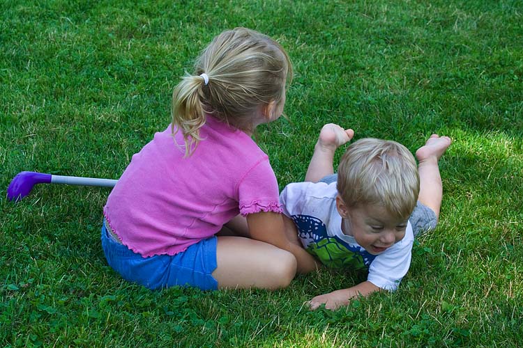 Wrestling Over a Golf Club