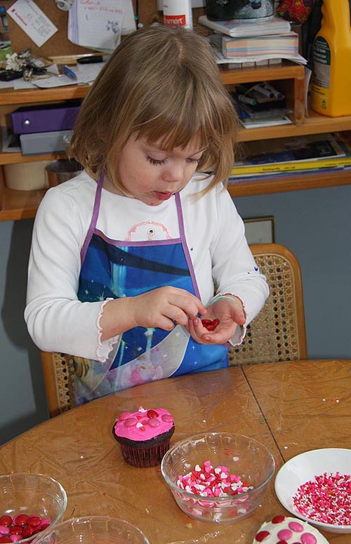 Teagan Decorating Cupcakes