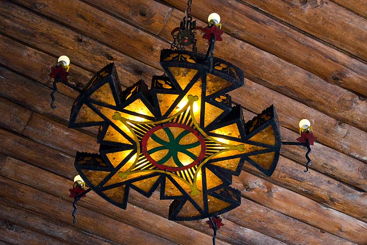 Fancy Chandelier Hanging from the Wooden Ceiling
