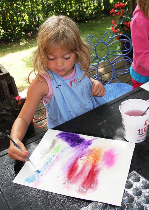 Teagan Paints Her Background