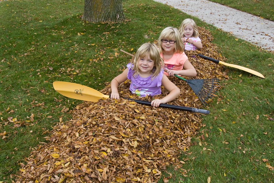 Three Girls in a Leafy Kayak