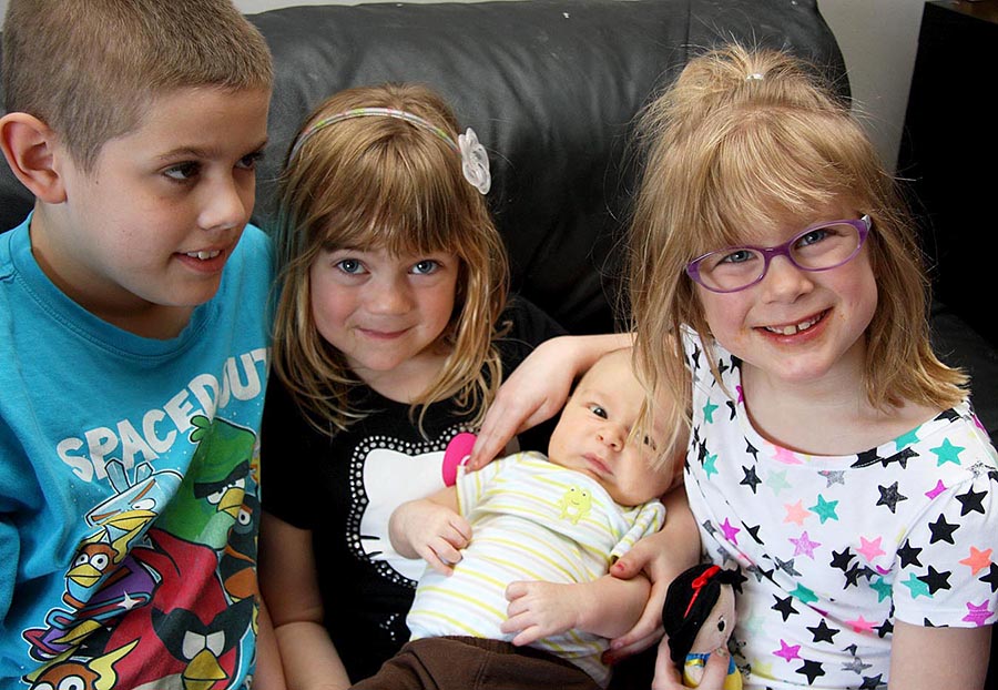 Brady, Teagan holding Elliot, and Rachel