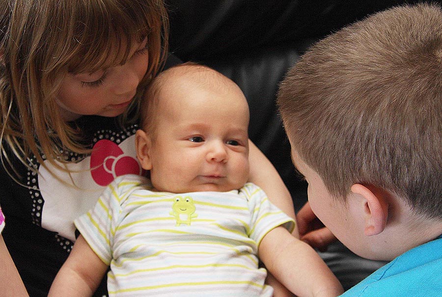Teagan Holds Elliot while Brady Talks to Him