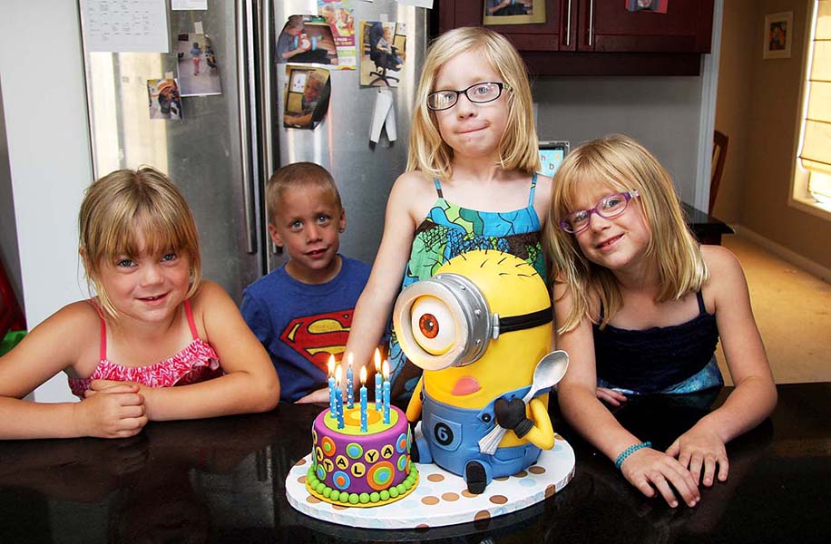 Everyone Posing with the Cake