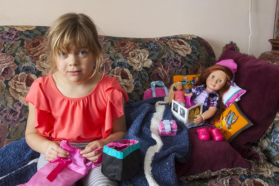 Teagan Setting Up Her Doll for a Picture