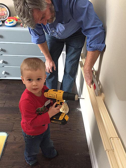 Helping Grandpa Put up the Train Shelf