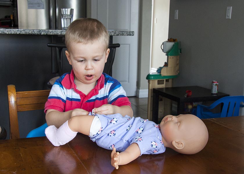 Changing his Baby's Diaper