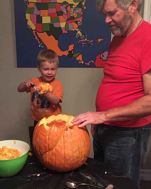Helping Grandpa Carve Pumpkins