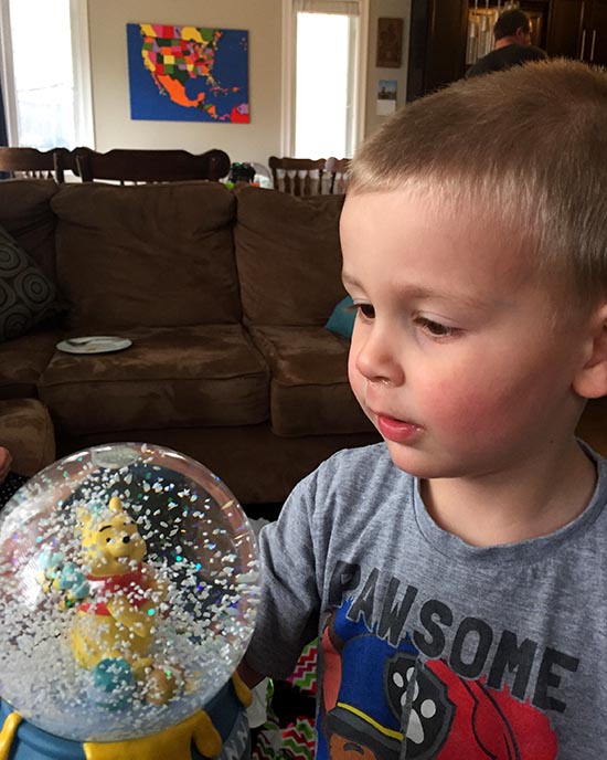 Elliot Admires Emily's Snow Globe