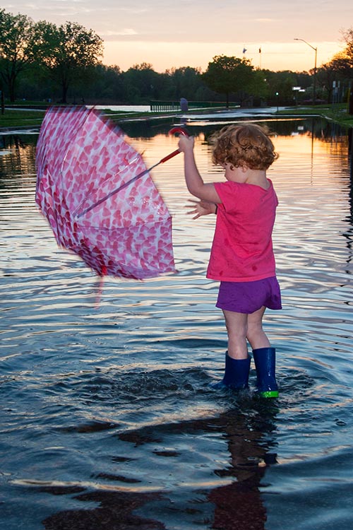 Turning her Umbrella into a Boat too