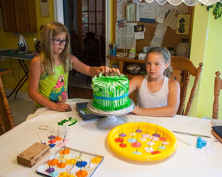 Decorating a Cake for their Mom's Birthday