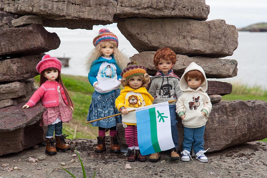 Posing with an Inukshuk in Red Bay