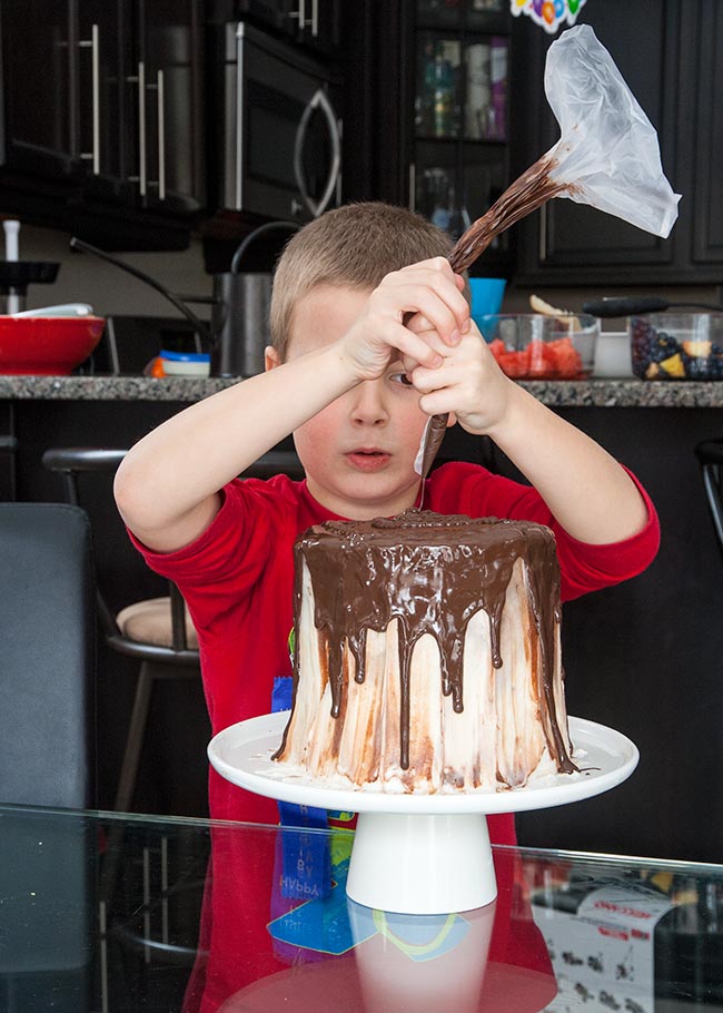 Squirting Chocolate Drips onto His Cake