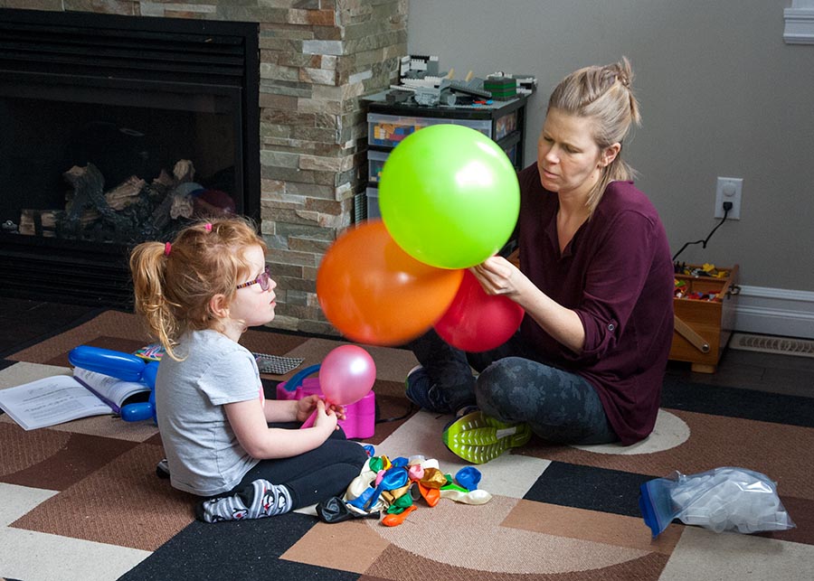 Helping Mo Blow up Balloons